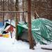 Tarps are secured over several tents to help keep the snow out at Camp Take Notice on Tuesday. Melanie Maxwell I AnnArbor.com